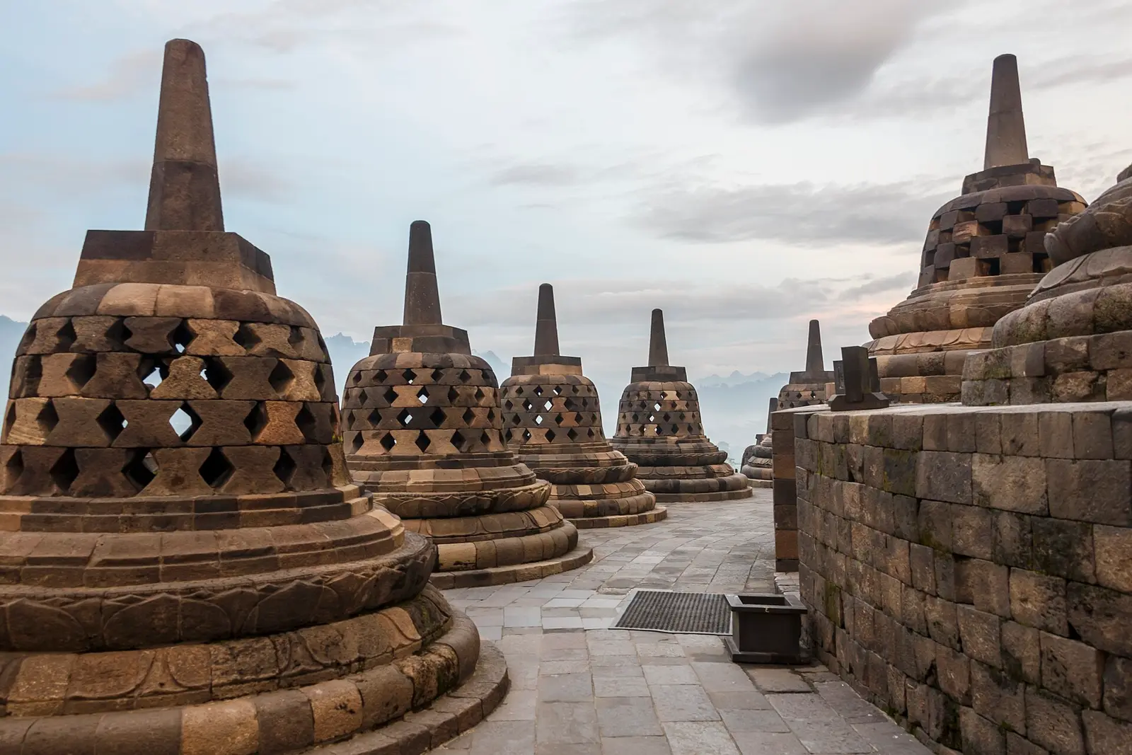 Perforated stupas on the upper terrace of Borobudur Temple at early morning